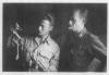 Del Meyers and Art Smedley with German sword at POW camp.