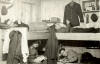 Inside POW barracks at Stalag Luft I - POWs reading and passing time