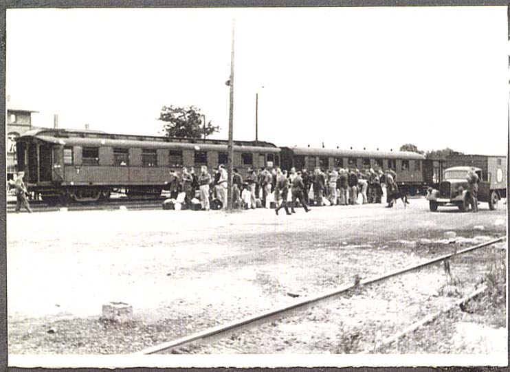 POWs at Barth, Germany train awaiting march to camp.